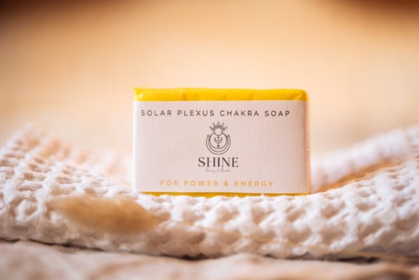 Solar Plexus Chakra Soap, wrapped on cream waffle fabric with blurred dried grass | Shine Body & Bath