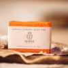 Sacral Chakra Soap, wrapped on crumpled brown paper with string, and an amethyst crystal | Shine Body & Bath