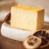 Solar Plexus Chakra Soap, with bubbles sitting on a stone soap dish with dried lemon slices | Shine Body & Bath