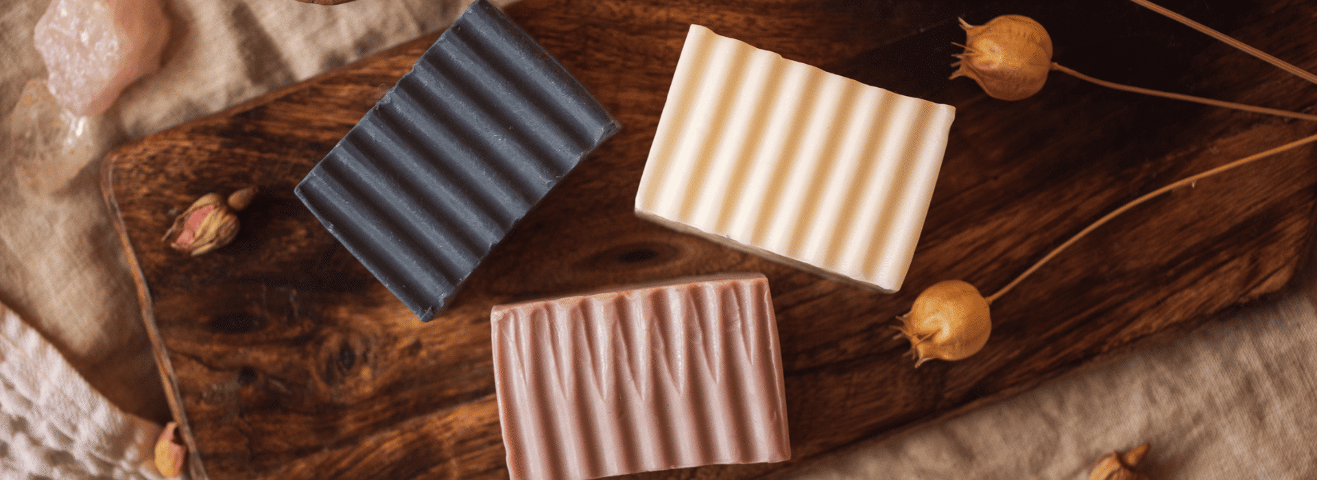 Upper Chakra Soaps unwrapped on board | Homepage banner | Shine Body & Bath