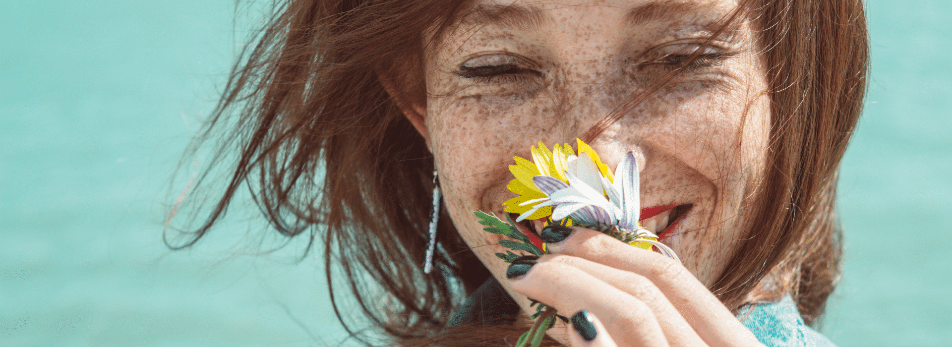 Essential Oils & Mood | Woman smelling flower | Shine Body & Bath Chakra Soap | Blog