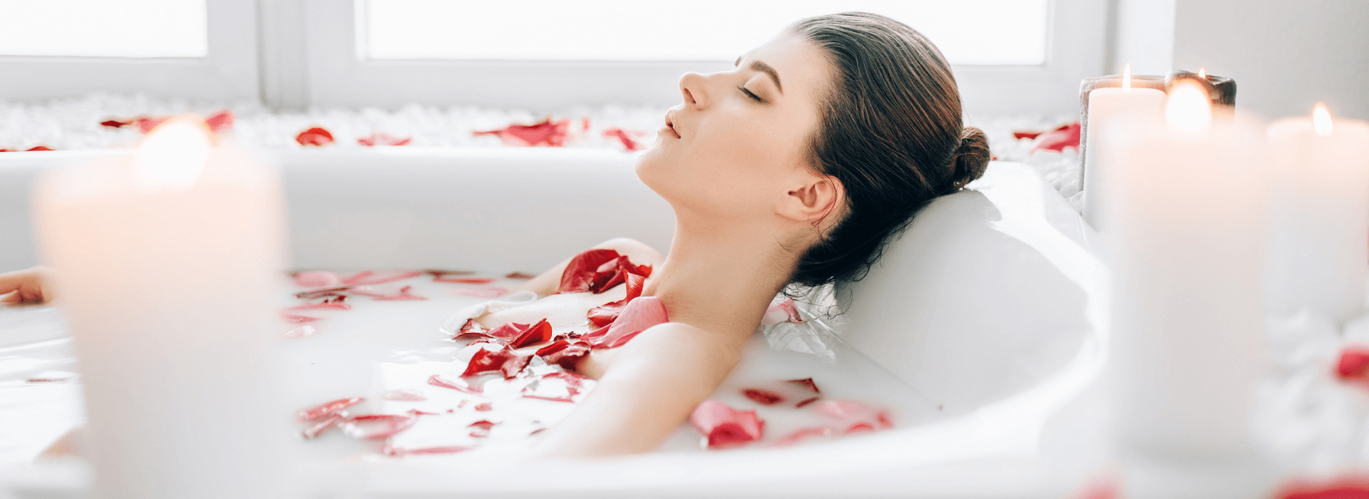 How to use your Chakra Soap | Woman relaxing bath surrounded by candles and petals | Shine Body & Bath Chakra Soap | Blog