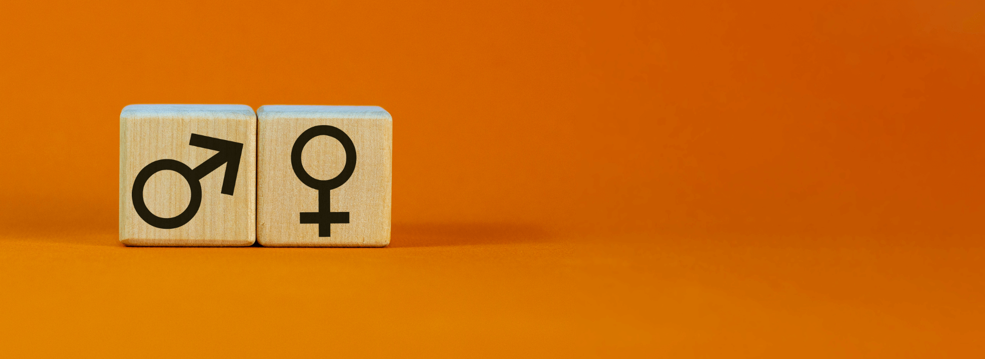 Chakra Balancing and Perimenopause | Wooden blocks with Male and Female symbols on orange background | Shine Body & Bath Chakra Soap | Blog