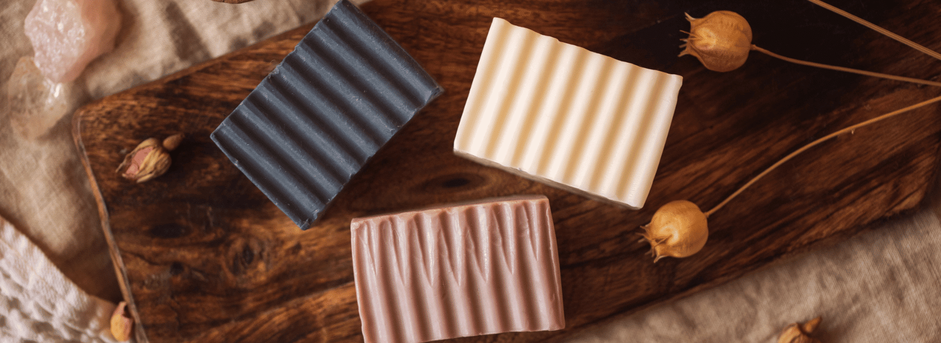 Throat, Third Eye and Crown Chakra soaps unwrapped on wooden board | The Secret to Breathing Well Blog | Shine Body & Bath Chakra Soap | Blog