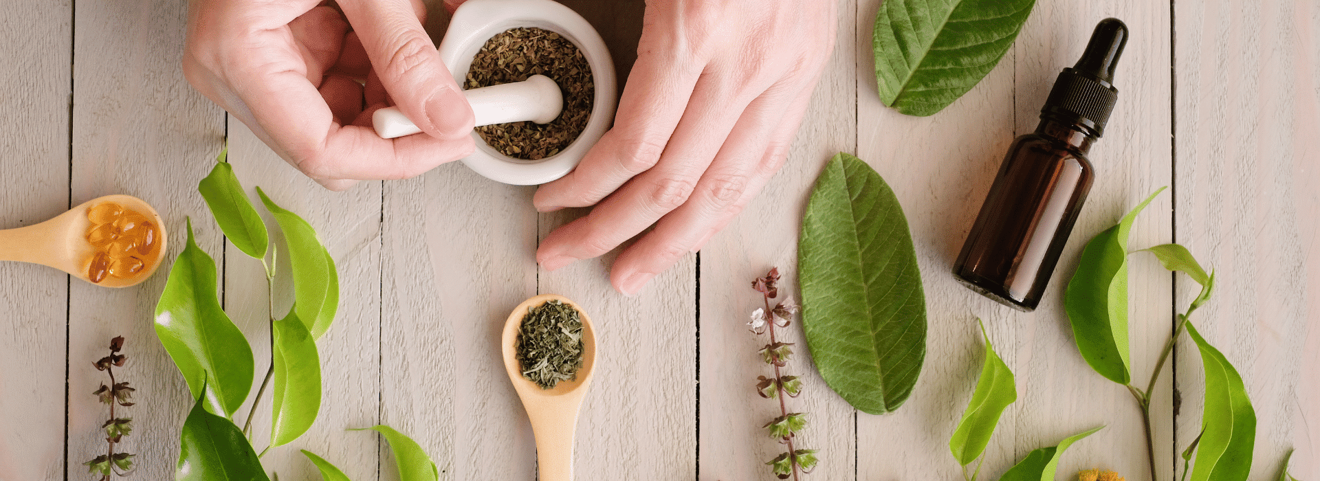 Person grinding natural ingredients with leaves and botanicals scattered about | Natural skincare – what’s the big deal? | Shine Body & Bath Chakra Soap | Blog