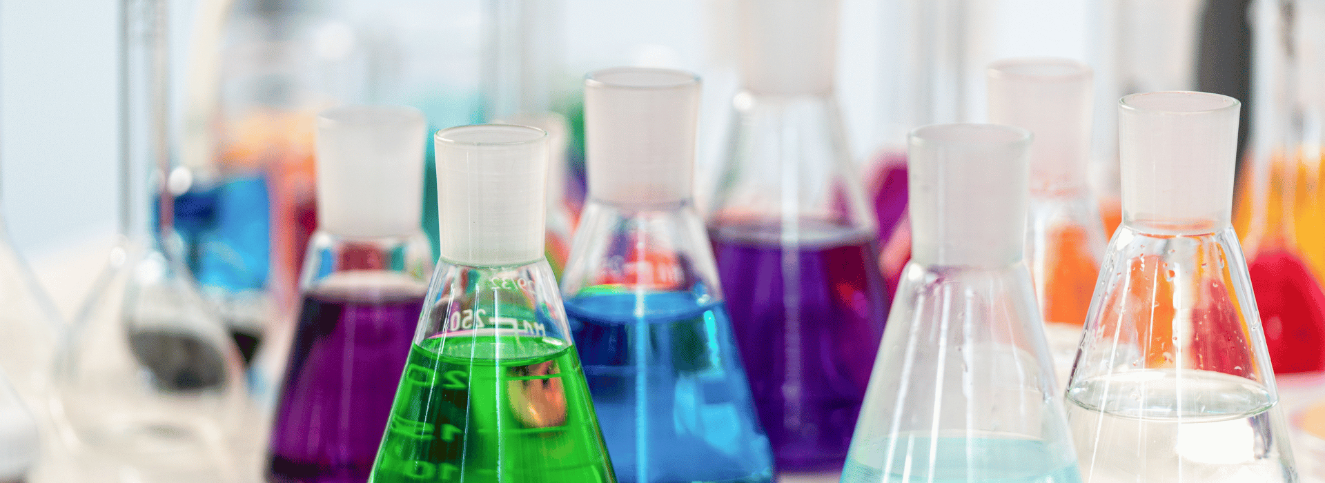 Bright coloured chemicals in glass flasks | Natural skincare – what’s the big deal? | Shine Body & Bath Chakra Soap | Blog