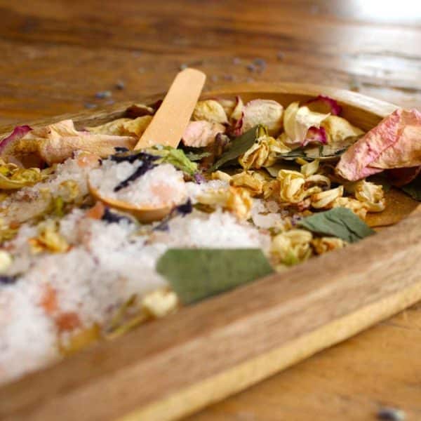 Loose Chakra Ritual bath salts with wooden spoon and petals on wooden tray | Shine Body & Bath
