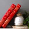 Root Chakra Ritual Bath Salts for Grounding & Strength | Glass jar of bath salts with red books | Shine Body & Bath