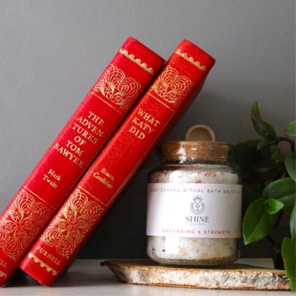 Root Chakra Ritual Bath Salts for Grounding & Strength | Glass jar of bath salts with red books | Shine Body & Bath