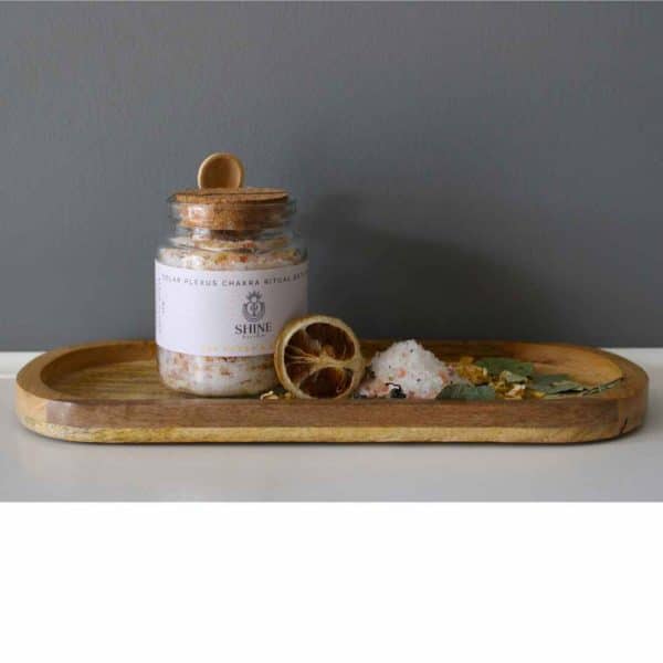 Solar Plexus Chakra Ritual Bath Salts for Power & Energy | Glass jar of bath salts on tray with lemon slice | Shine Body & Bath