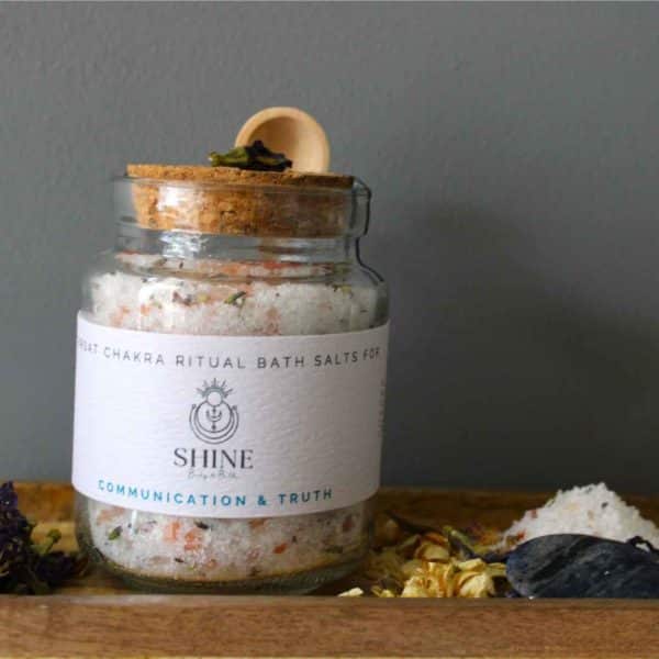 Throat Chakra Ritual Bath Salts for Communication & Truth | Glass jar of bath salts on shelf with blue crystal | Shine Body & Bath