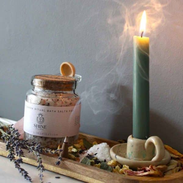 Crown Chakra Ritual Bath Salts for Spirit & Inspiration | Glass jar of bath salts on shelf with green candle | Shine Body & Bath