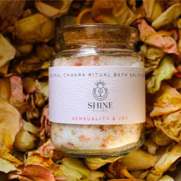Sacral Chakra Ritual Bath Salts for Sensuality & Joy | Glass jar of bath salts on bed of petals | Shine Body & Bath