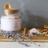 Crown Chakra Ritual Bath Salts for Spirit & Inspiration | Glass jar of bath salts on shelf with lavender stems and incense cone | Shine Body & Bath