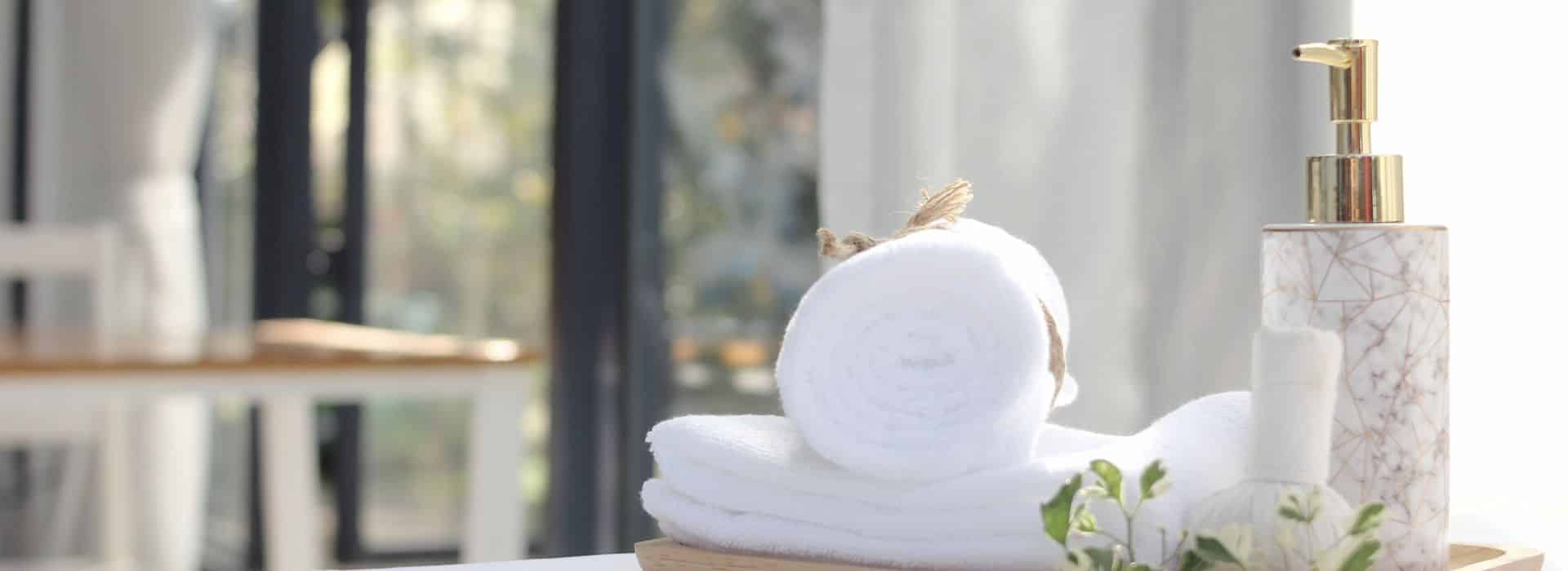 Beautiful towels on the side of a bath | The Perfect Bath: Create the Ultimate Ritual Bathing Experience | Shine Body & Bath Blog