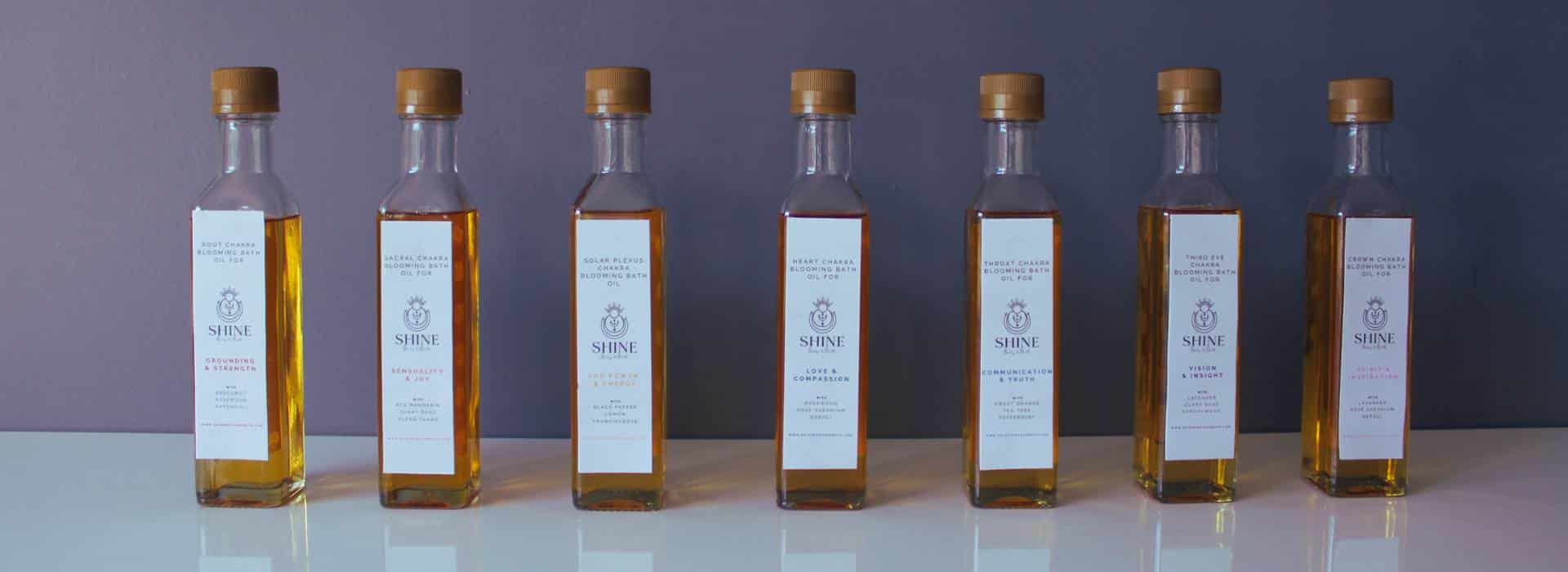 Seven Chakra Blooming Bath Oils on a row | Homepage banner | Shine Body & Bath