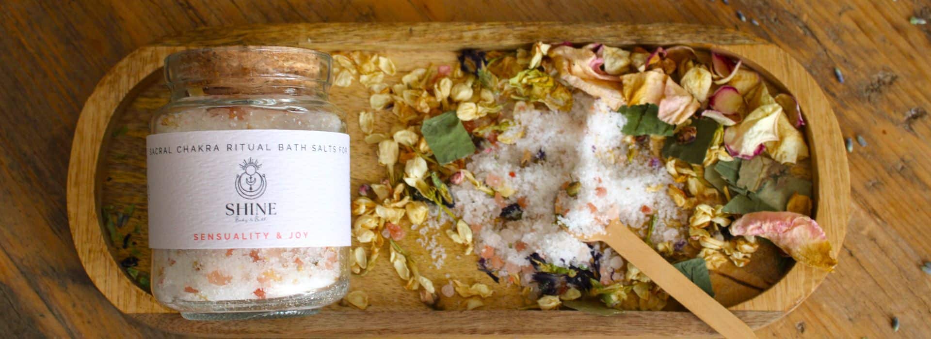 Sacral Chakra Ritual Bath Salts on tray with petals and spoon | How to live more joyfully | Shine Body & Bath Chakra Soap | Blog