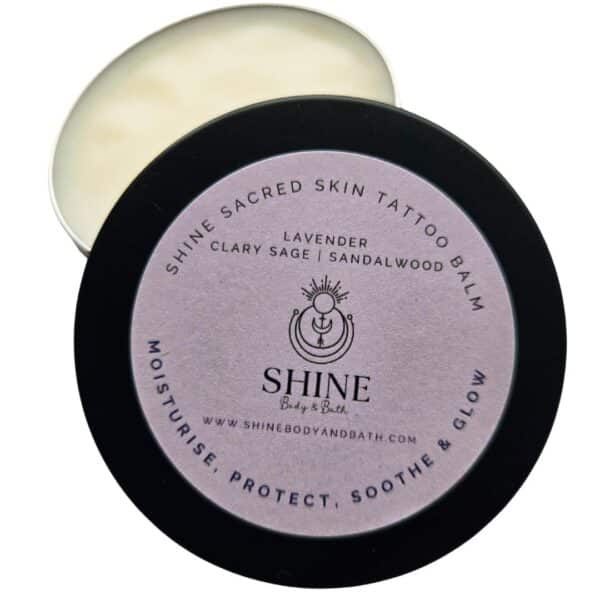 Shine Sacred Skin Tattoo Balm | Cutout image of front of open tin