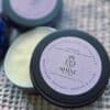 Shine Sacred Skin Tattoo Balm | Flat lay of tins of balm super close up