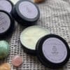 Shine Sacred Skin Tattoo Balm | Flat lay of tins of balm with crystals