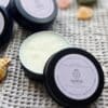 Shine Sacred Skin Tattoo Balm | Flat lay of tins of balm close up