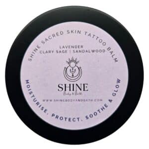 Shine Sacred Skin Tattoo Balm | Cutout image of front of tin