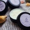 Shine Sacred Skin Tattoo Balm | Flat lay of tins of balm 2