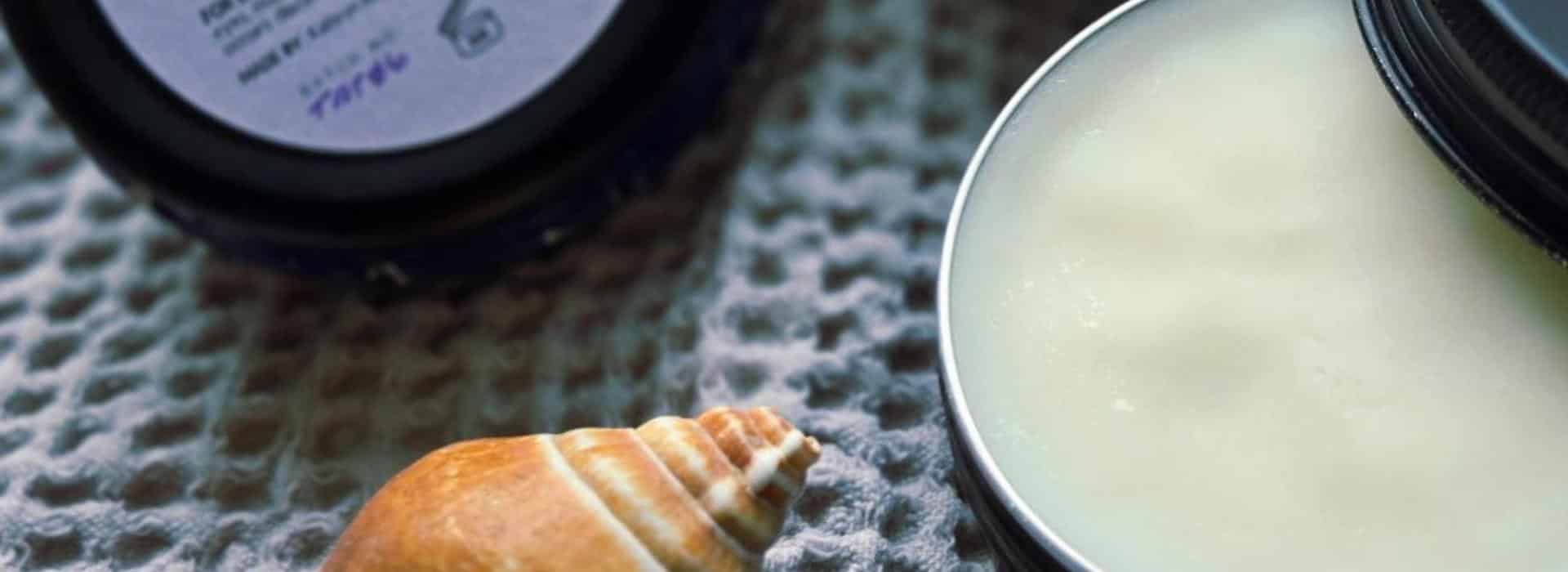 Sacred Skin: Why a Tattoo Balm is Essential for Your Ink (and Your Soul) | Image of Sacred Skin balms styled with a seashell