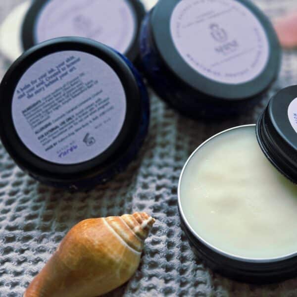 Shine Sacred Skin Tattoo Balm | Flat lay of tins of balm 1