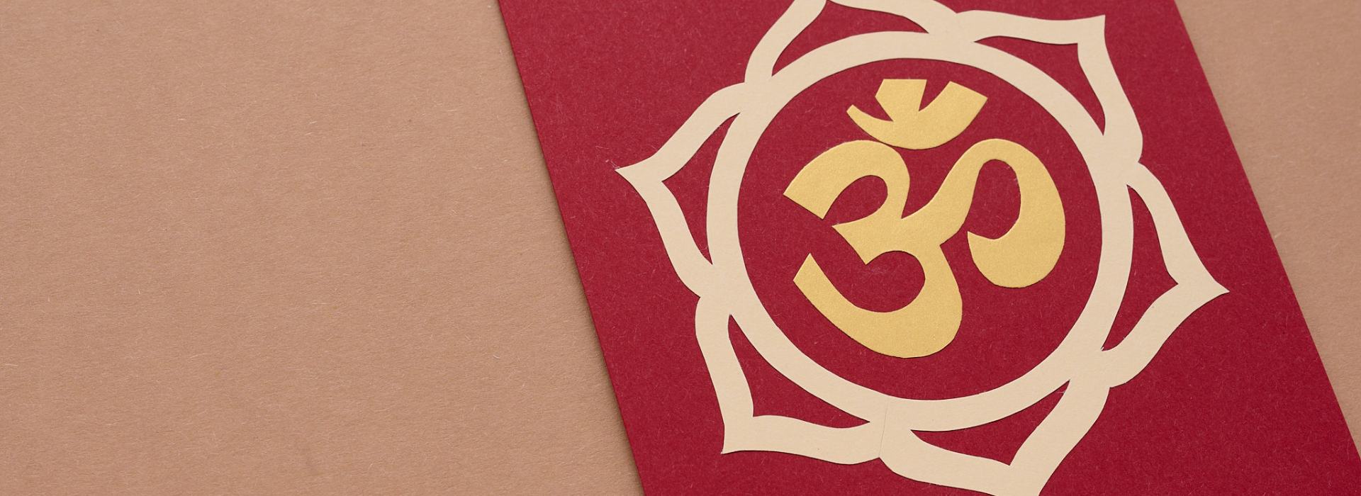 The Chakra System for Beginners - Your Complete Guide | A book with the Root Chakra symbol