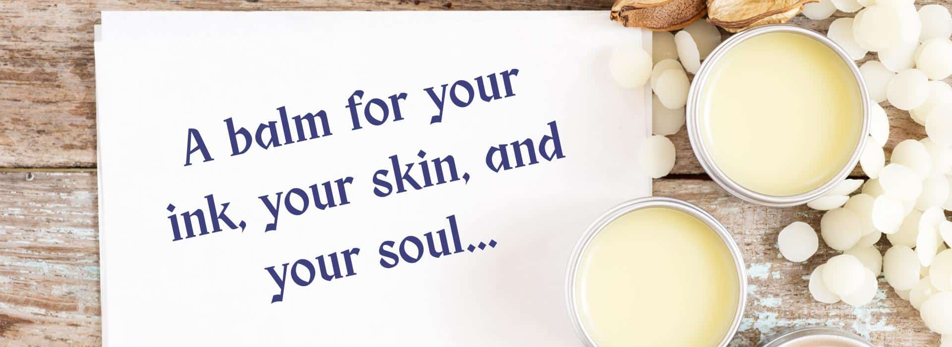 Sacred Skin: Why a Tattoo Balm is Essential for Your Ink (and Your Soul) | Image of Balms and a handwritten sign saying: A balm for your ink, your skin, and your soul...
