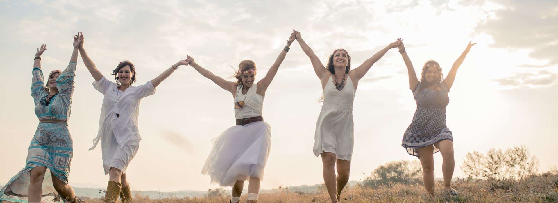 The Chakra System for Beginners - Your Complete Guide | Picture of Happy women holding hands