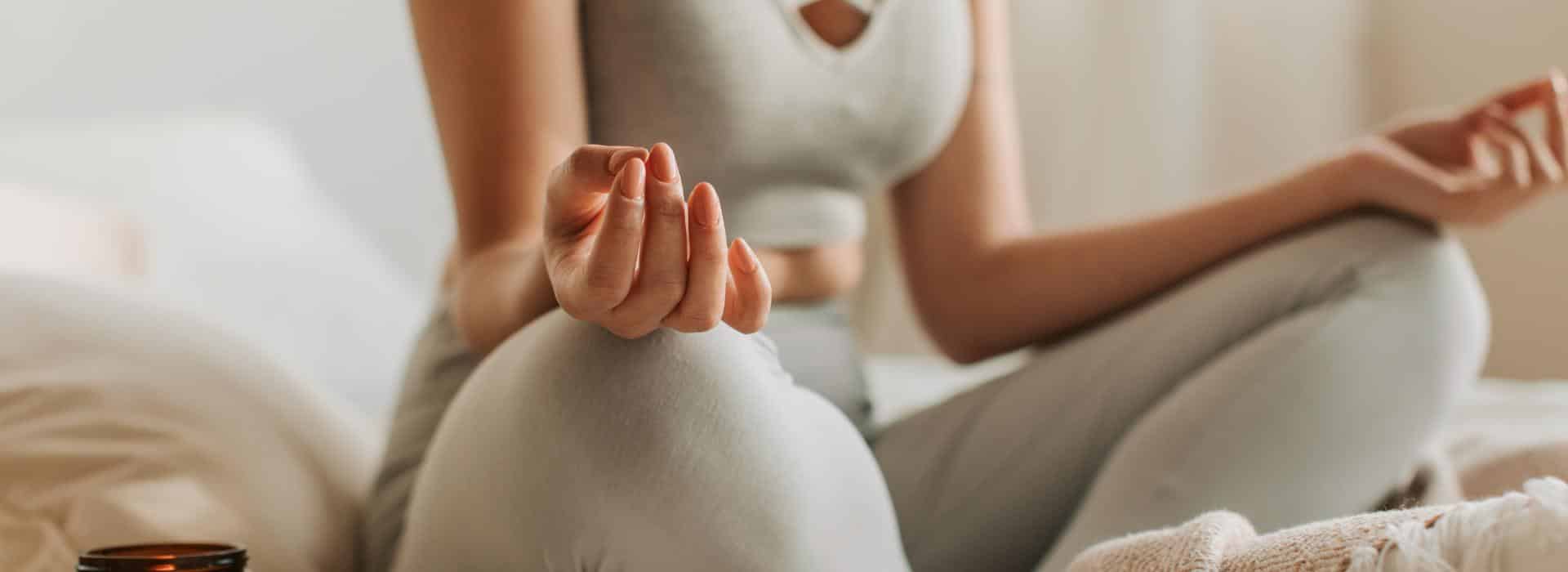 Manifesting vs Liberating Energy | Woman in yoga meditation pose